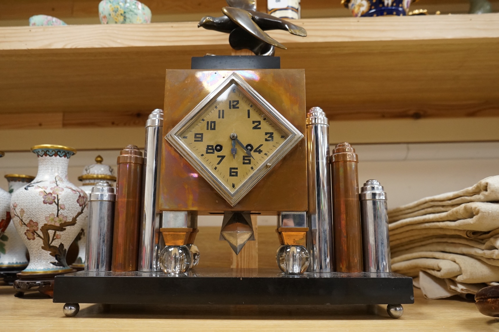 An French Art Deco copper and chrome mantel clock, with bronze seagull surmount, 57cm high